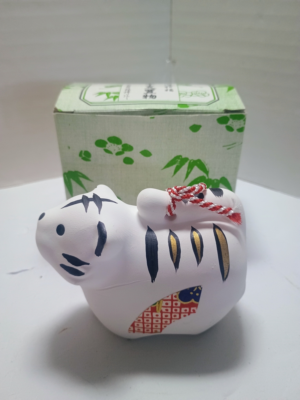 Hand-Painted White Ceramic Tiger Figurine with Red Cord